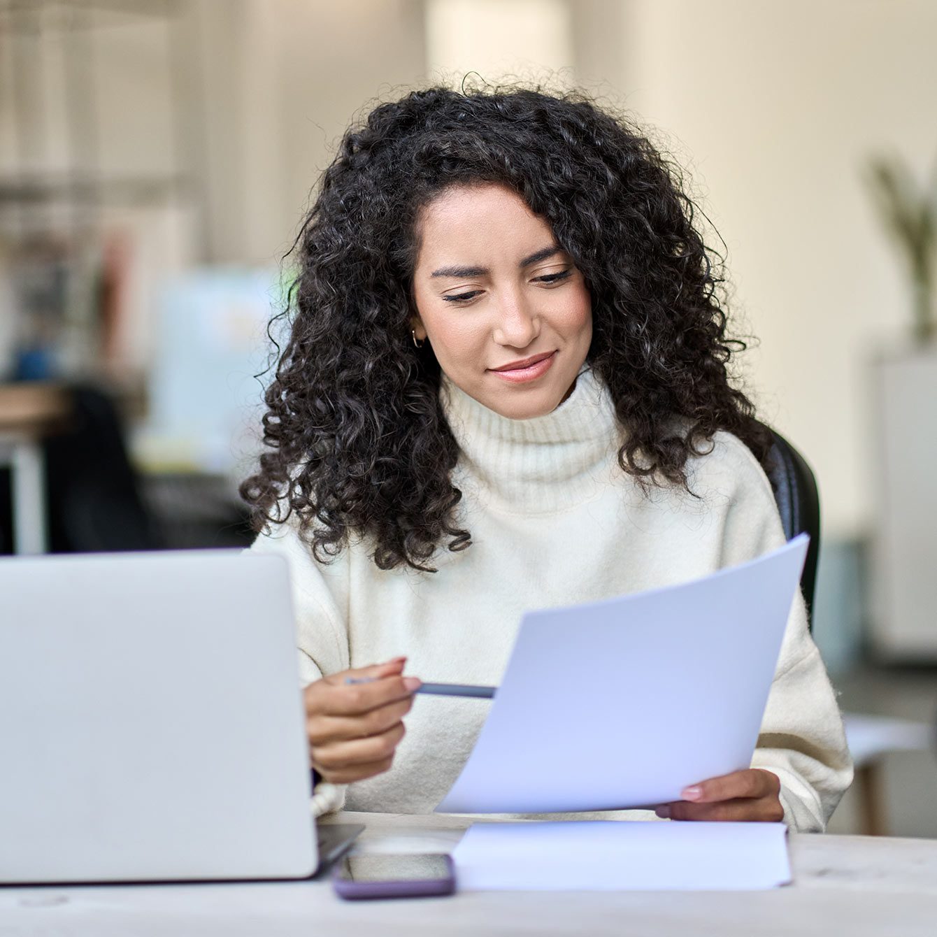 Young woman conducting A/B testing, analyzing results