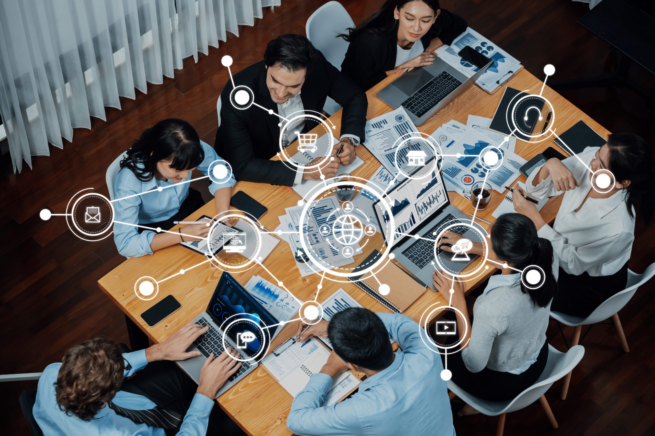 a group of individuals in a conference room discussing strategy