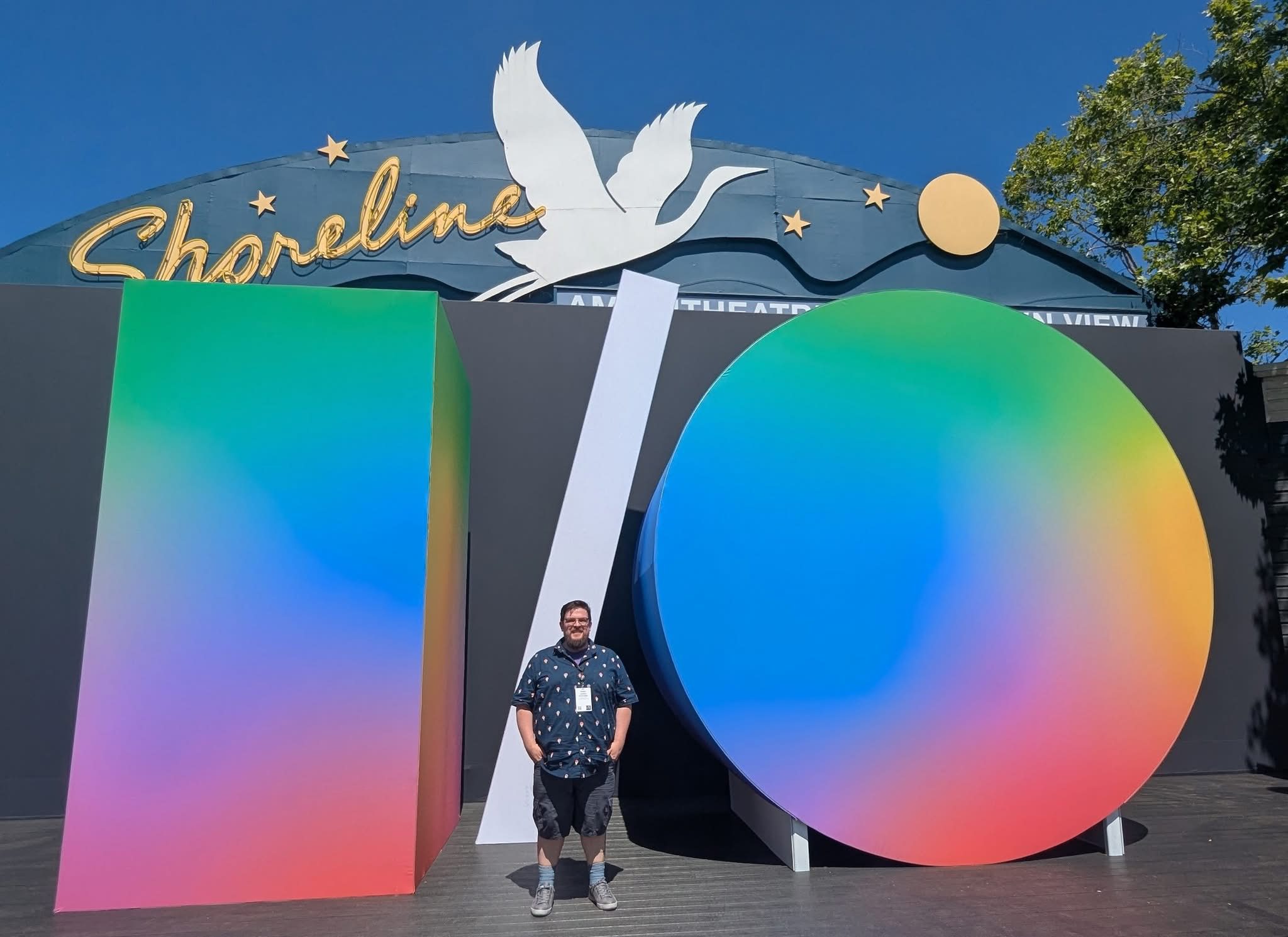 Image of Web Developer Jeremy Schroeder standing in front of the Google I/O logo outside a conference venue.